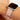 Pink Apple Watch band on model against neutral background