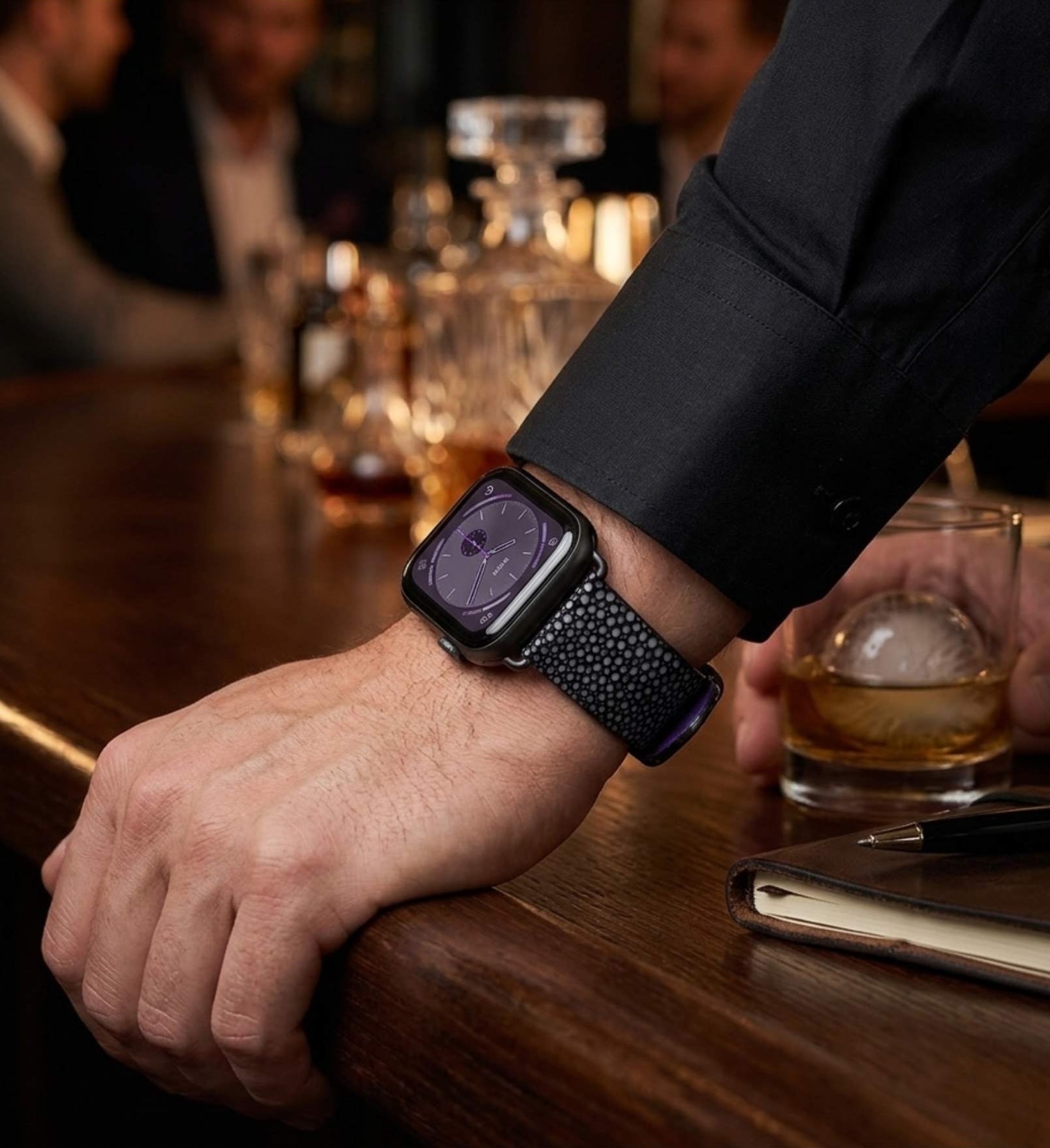 Man wearing the Bedarra in black Apple Watch band in a bar setting