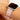 Pink Apple Watch band on model against neutral background