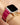 Woman wearing Orleans in Fuchsia Apple Watch band with a jewelry stack