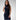 Model wearing the Sonora metallic silver lizard, luxury Apple Watch band wearing a long navy dress.
