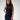 Model wearing the Sonora metallic silver lizard, luxury Apple Watch band wearing a long navy dress.