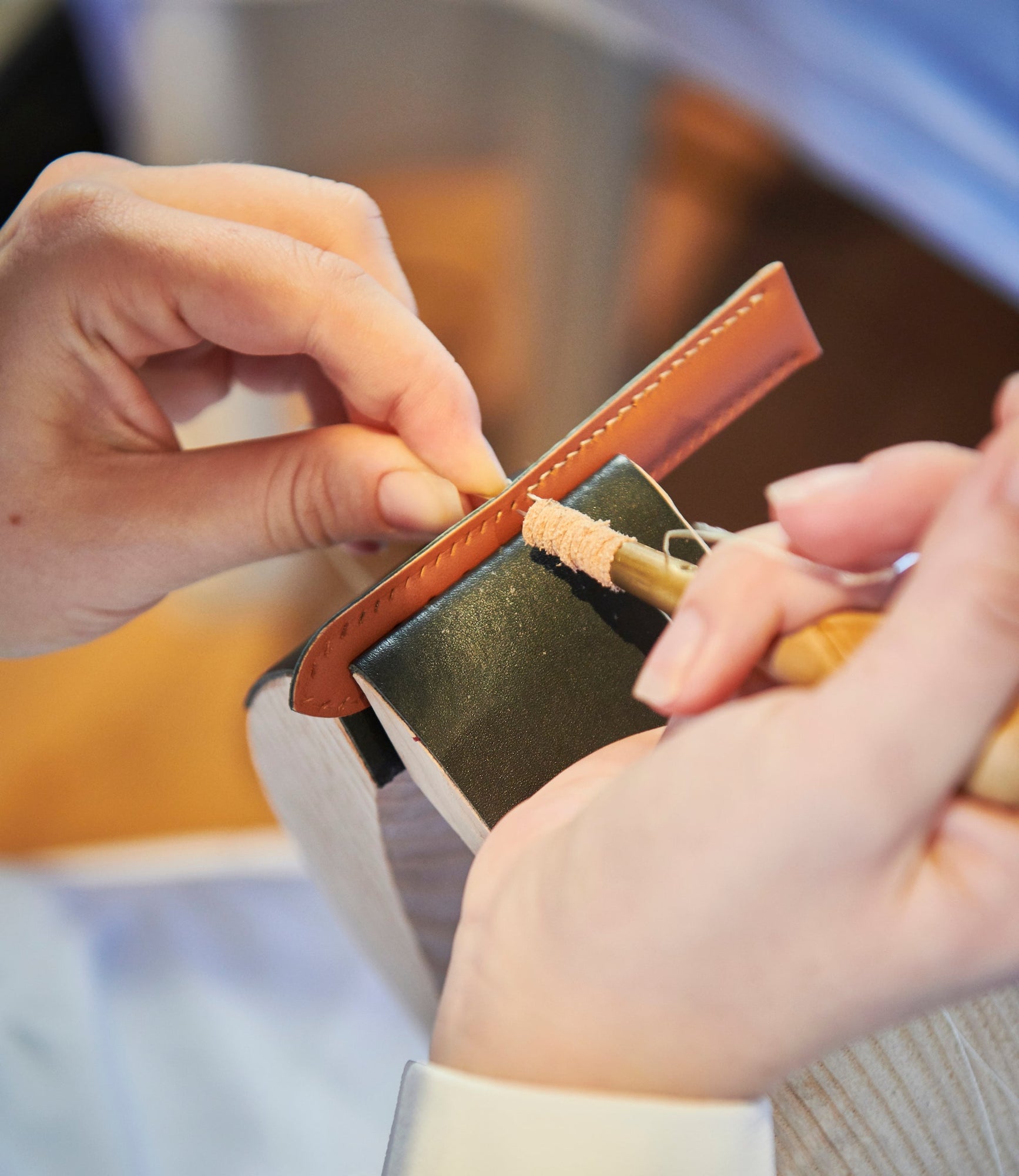 Craftsman handcrafting a Chalonne leather band