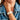 Close-up of a woman in denim jacket wearing the Denarius in white luxury Apple Watch band.