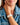 Close-up of a woman in denim jacket wearing the Denarius in white luxury Apple Watch band.