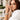 A woman in a white blazer wearing the Gelato in Earl Gray Apple Watch band.