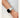 A close-up of a woman wearing the Gelato in Iced Blue luxury Apple Watch band by Chalonne with a fuzzy white and pastel blue ombre dress. 