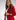 Liquid in red shiny patent leather luxury Apple Watch band on model wearing red blazer and white pants 