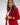 Liquid in red shiny patent leather luxury Apple Watch band on model wearing red blazer and white pants 