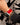 Liquid in Red Apple Watch band on model with black and gray top