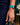 Model wearing liquid in teal apple watch band by Chalonne styled with dark denim jeans