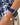 Model wearing the Orleans in Azure luxury Apple Watch band with a blue floral dress.