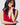 A woman with dark hair wearing the Orleans in Fuchsia Apple Watch band with a low cut red dress.