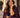 A woman wearing the Orleans in Yellow Apple Watch band with a plum suit.