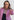 Woman wearing the Sedona in Black Luxury Apple Watch Band with stitching and a black dress and pink blazer- Chalonne