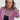 Woman wearing the Sedona in Black Luxury Apple Watch Band with stitching and a black dress and pink blazer- Chalonne