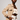 A model wearing the Waiheke in cream shearling Apple Watch band and a beige trench coat over a cream crop top and white pants